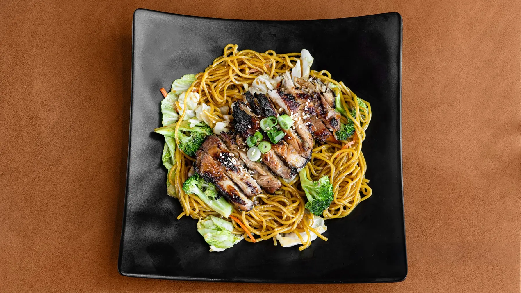 Noodles topped with sliced brisket